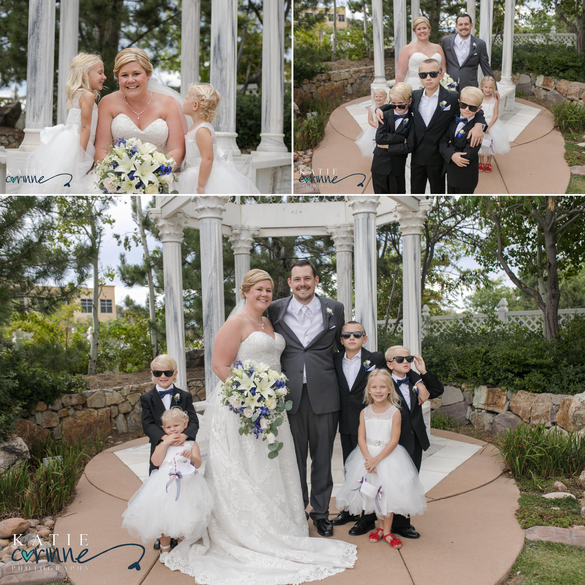 wedding couple pose with flower girls and ring bearers