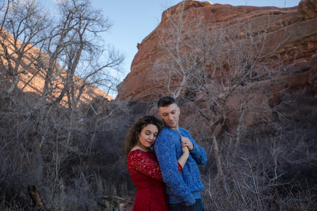 engaged couple at red rocks in Colorado