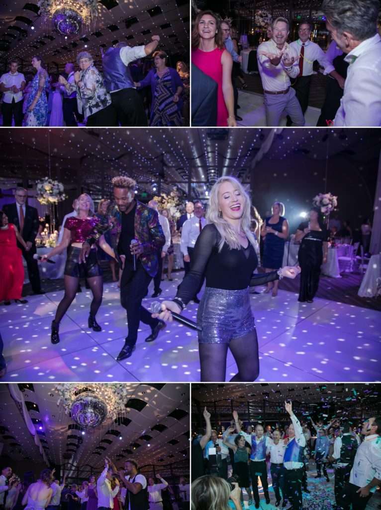 guests dance at purple themed wedding reception