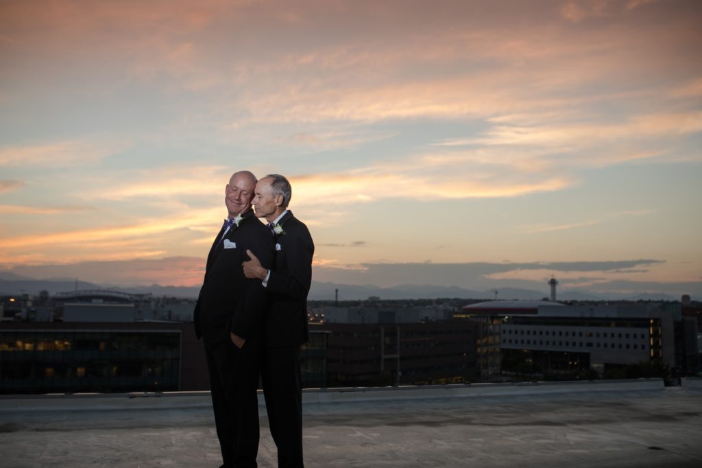 Denver grooms take a quiet moment at sunset