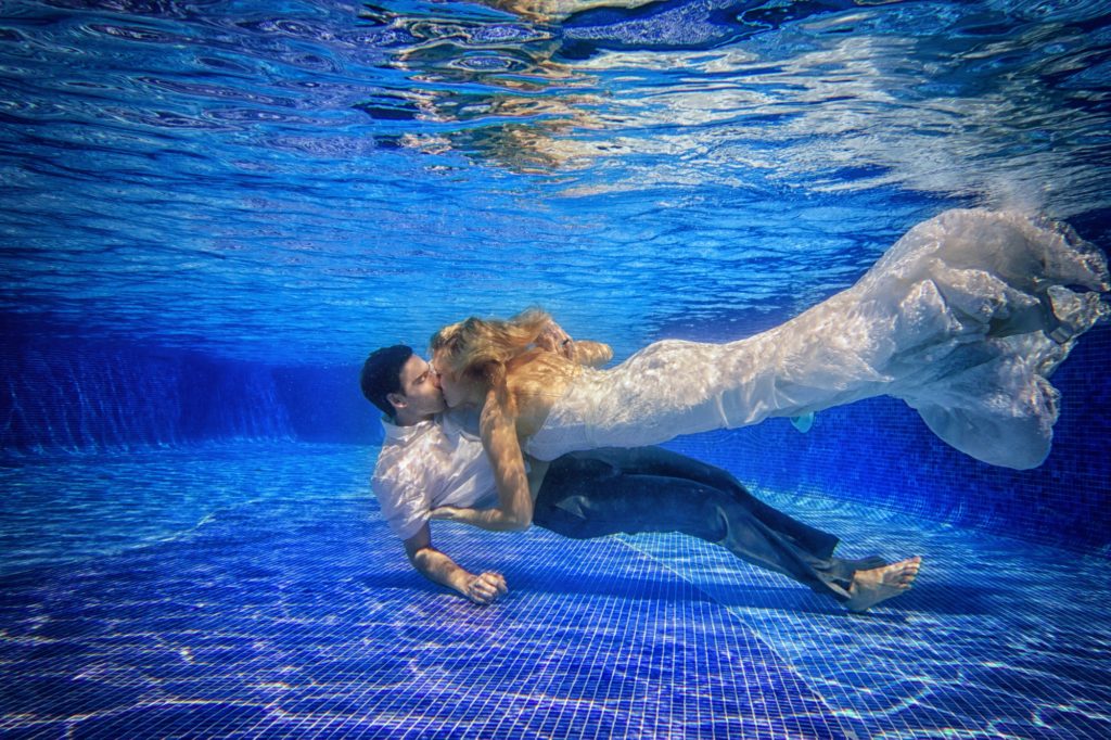 under water wedding photos in Dominican Republic resort pool