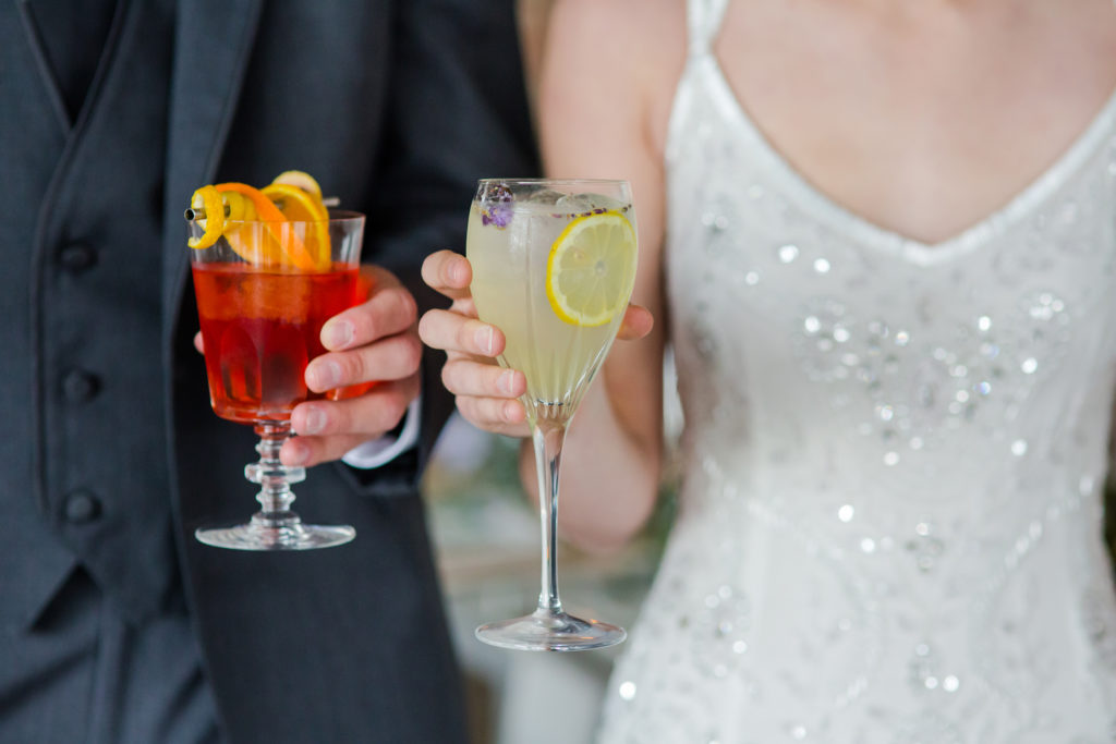 Bride and Groom holding pretty drinks