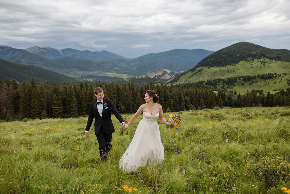 Bride and Groom walking in the mountains