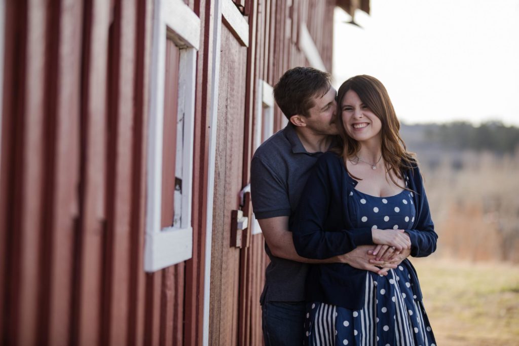 Colorado engaged couple next to barn