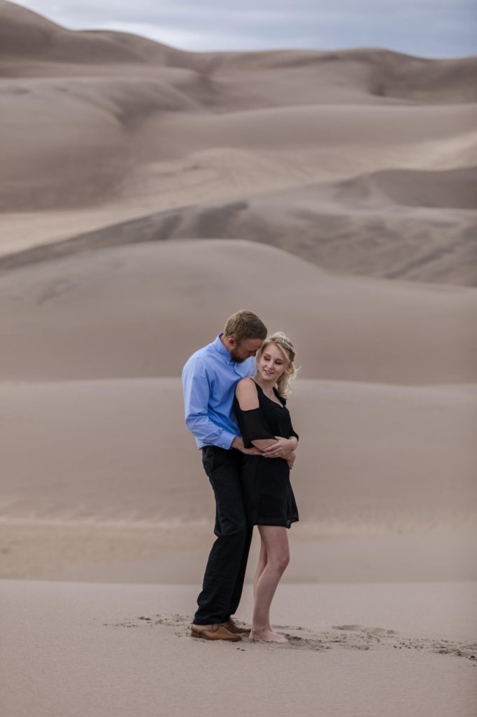 Couple at colorado sand dunes for engagement session