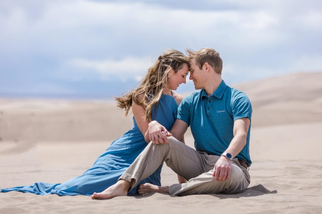 Adventurous couple photographed on sand dunes