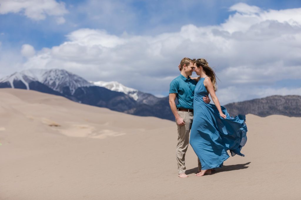 Engaged couple on Colorado sand dunes