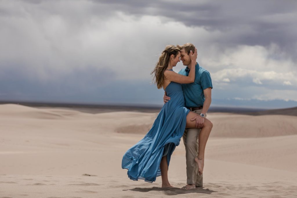 Engaged couple at Colorado sand dunes