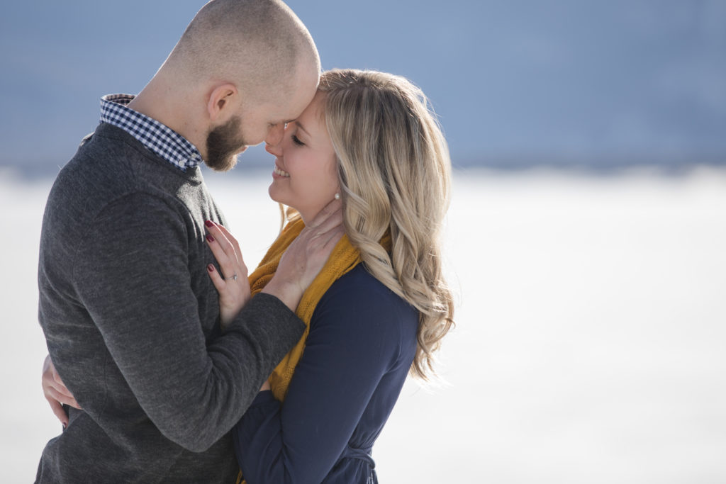 Colorado couple kiss at their winter engagement session
