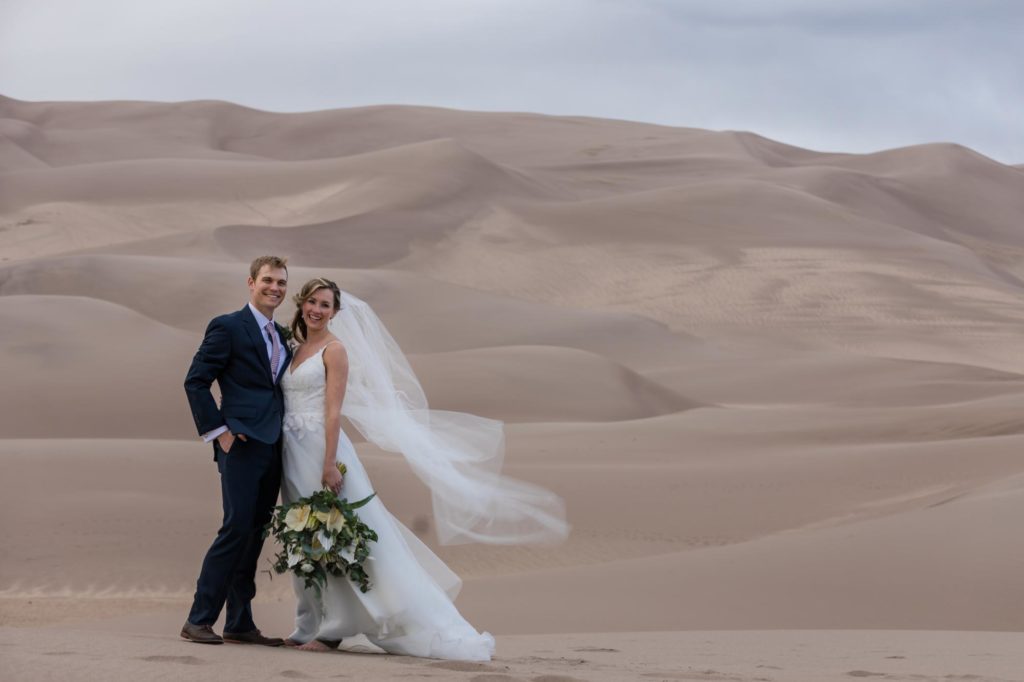 Colorado bride and groom in front of mountains on day after wedding