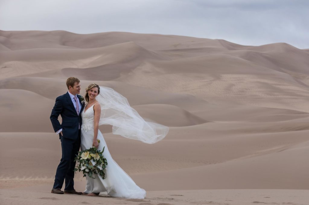 Denver bride and groom in front of mountains on day after wedding