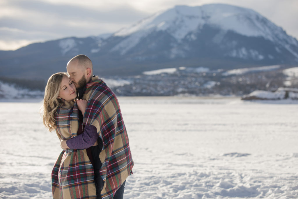 Cozy Colorado couple at Lake Dillon winter engagement session
