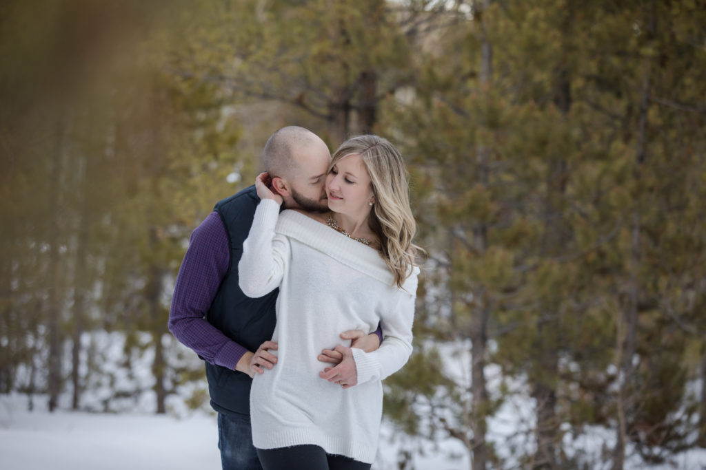 Colorado couple in front of Evergreen forest