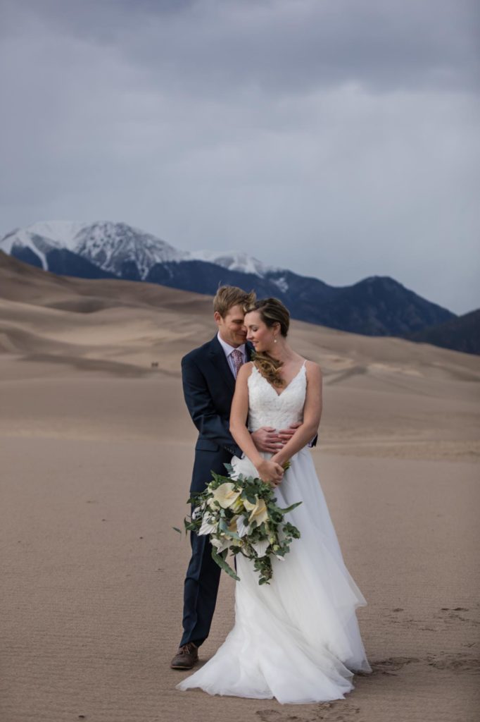 Colorado couple in front of mountains on day after wedding