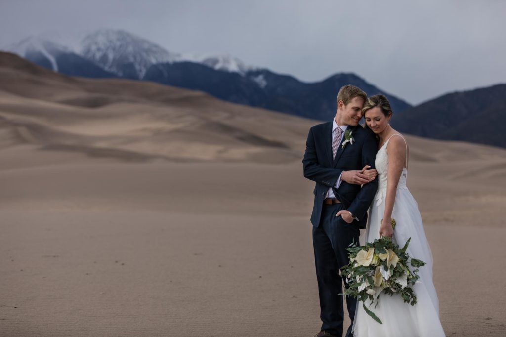 Denver Couple in front of mountains on day after wedding