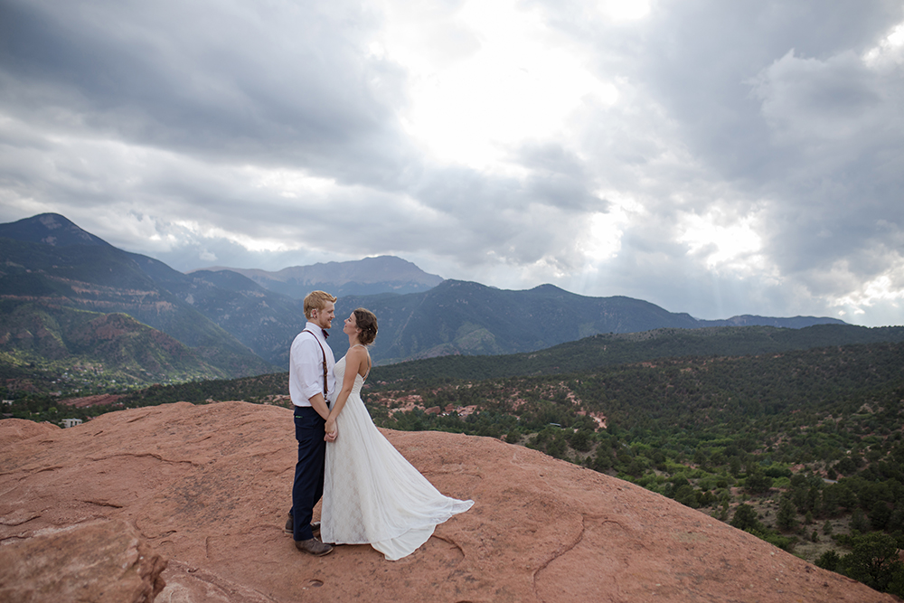 couple planning your elopement overlooks mountains