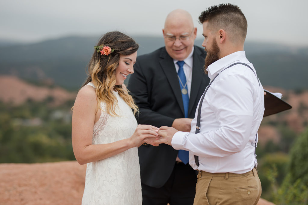 Eloping couple exchange rings with officiant in GOG elopement package