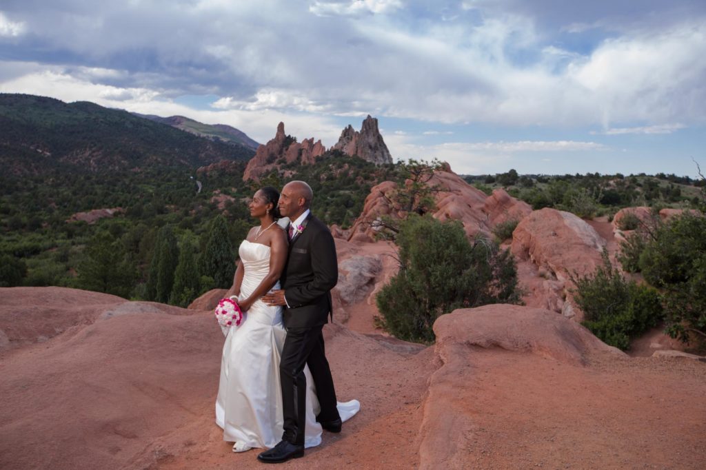 couple watches sunset at their mountain elopement