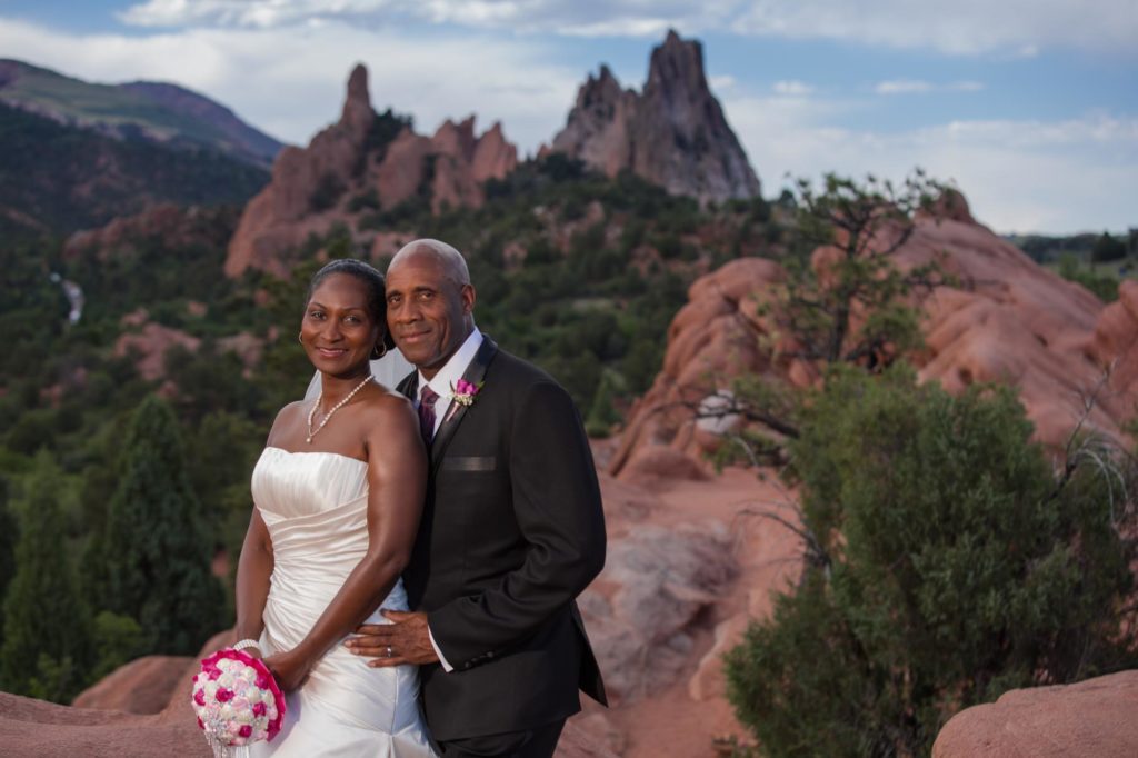 couple poses for mountain wedding photographer