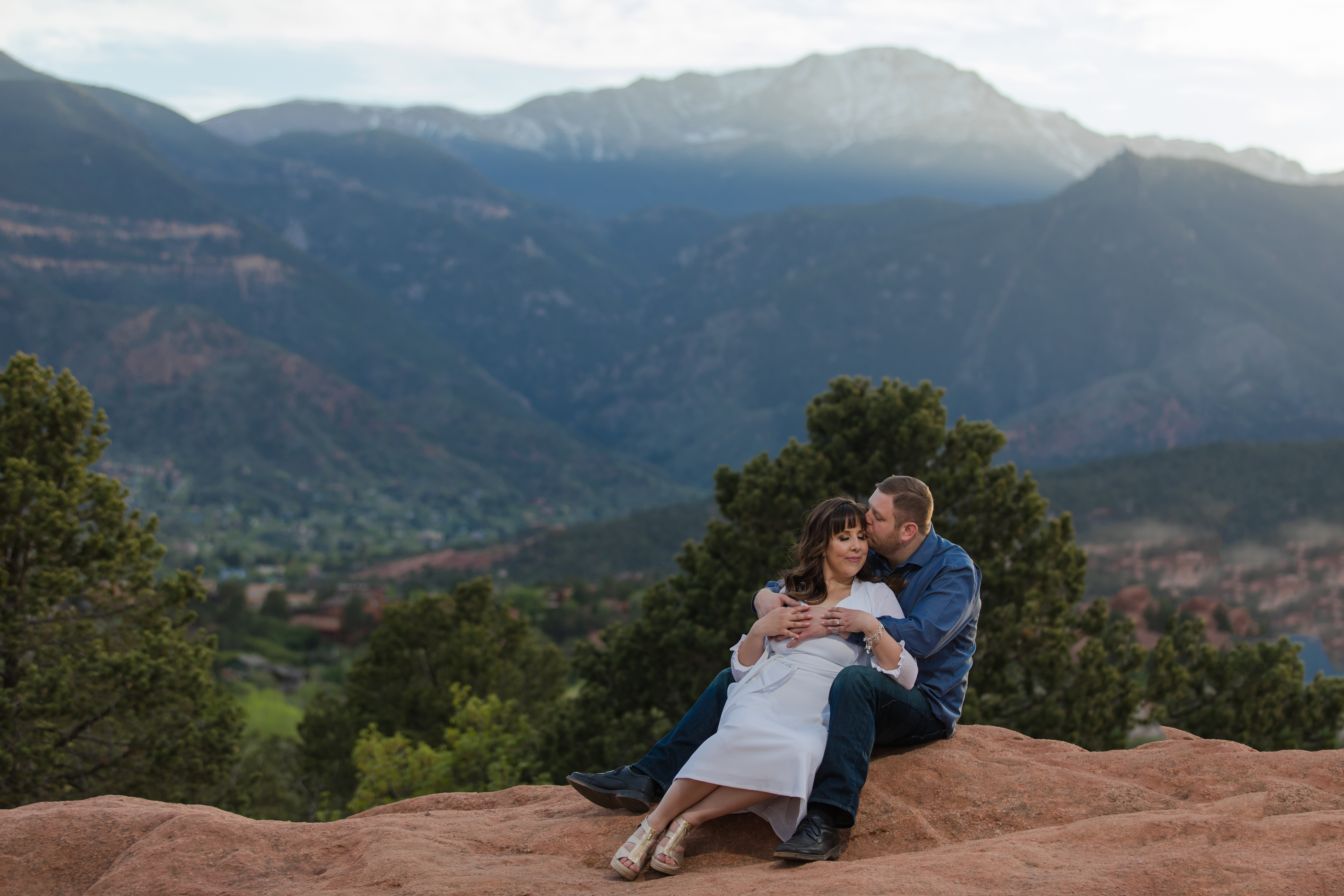 engaged couple pose for Colorado wedding photographer