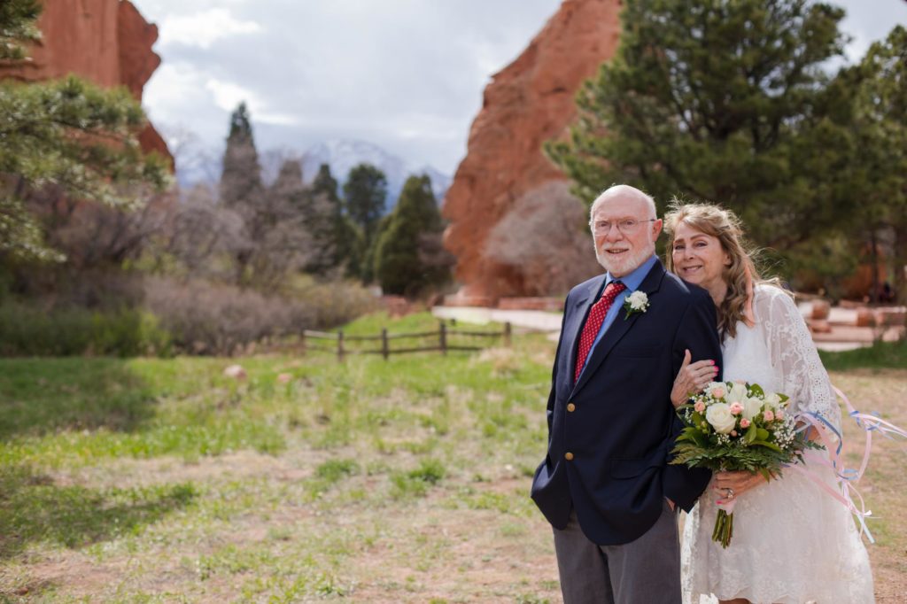 couple poses for mountain elopement photographer