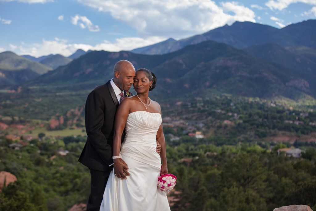 bride and groom in front of Rocky Mountains