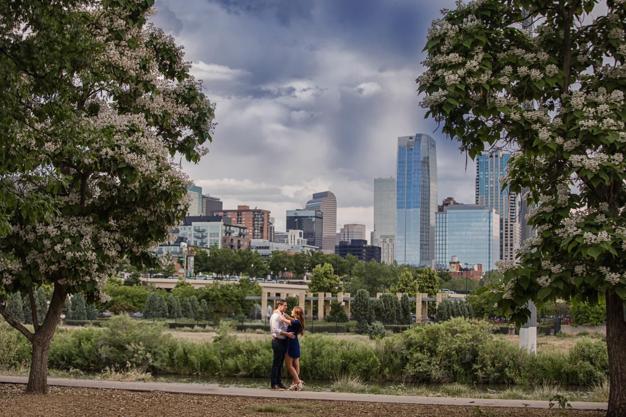 Engaged couple overlook downtown Denver