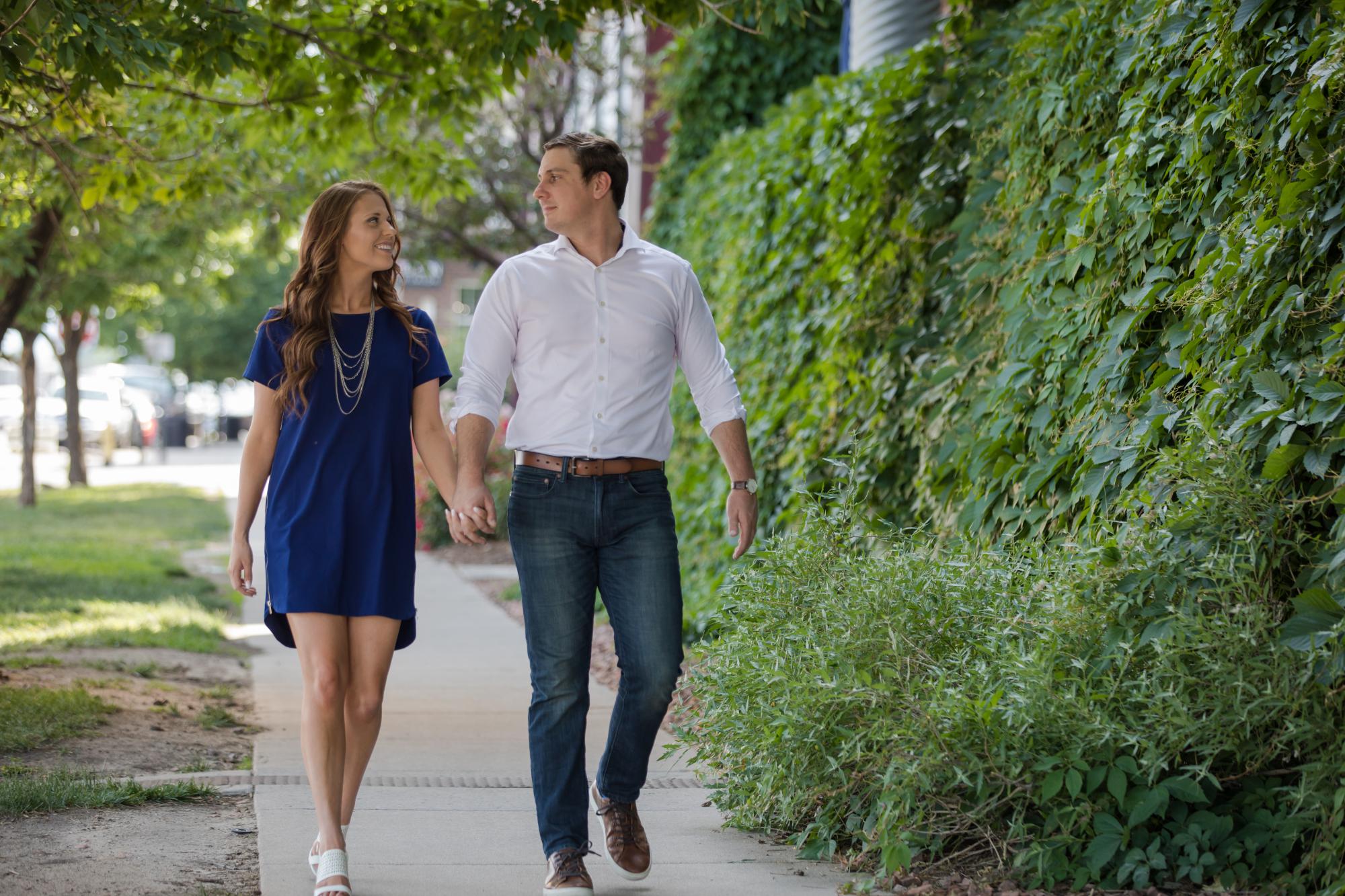 Couple walks through downtown denver
