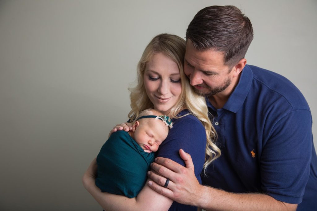 Colorado couple holds newborn daughter