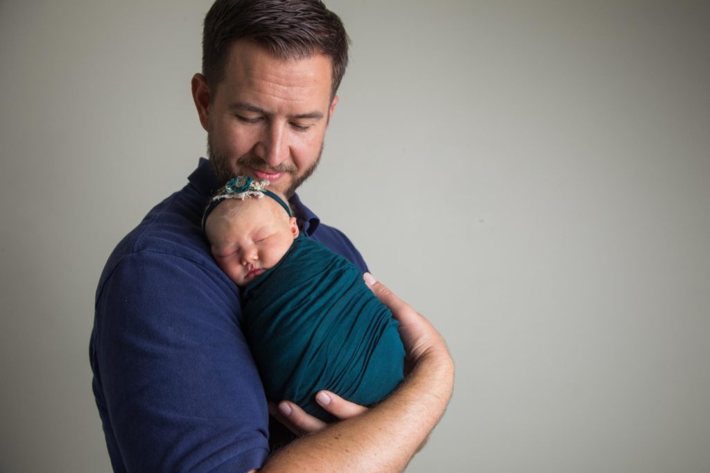 Colorado dad holds baby girl