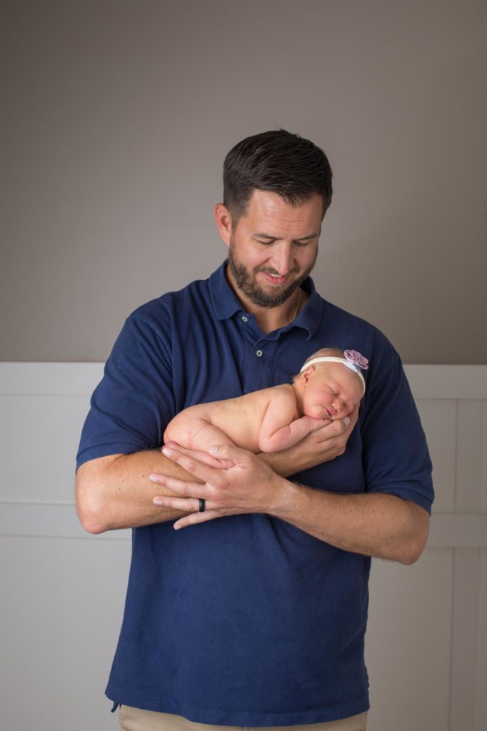 Colorado dad holds newborn daughter