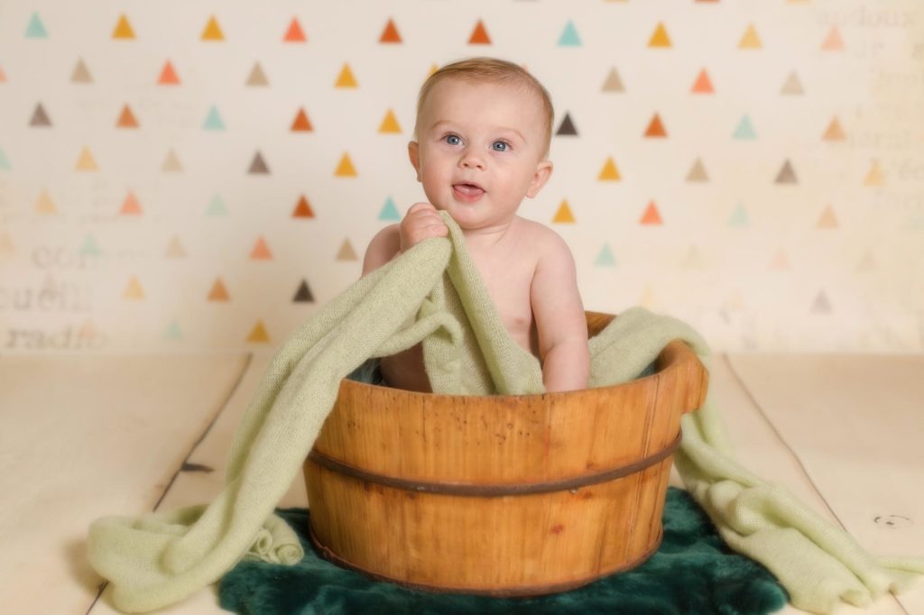 Baby in basket during Colorado milestone session