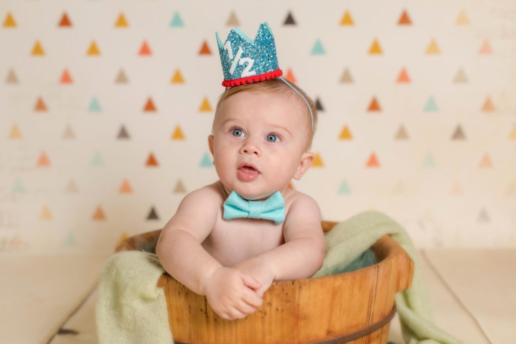 Colorado six month old baby wearing crown and bowtie