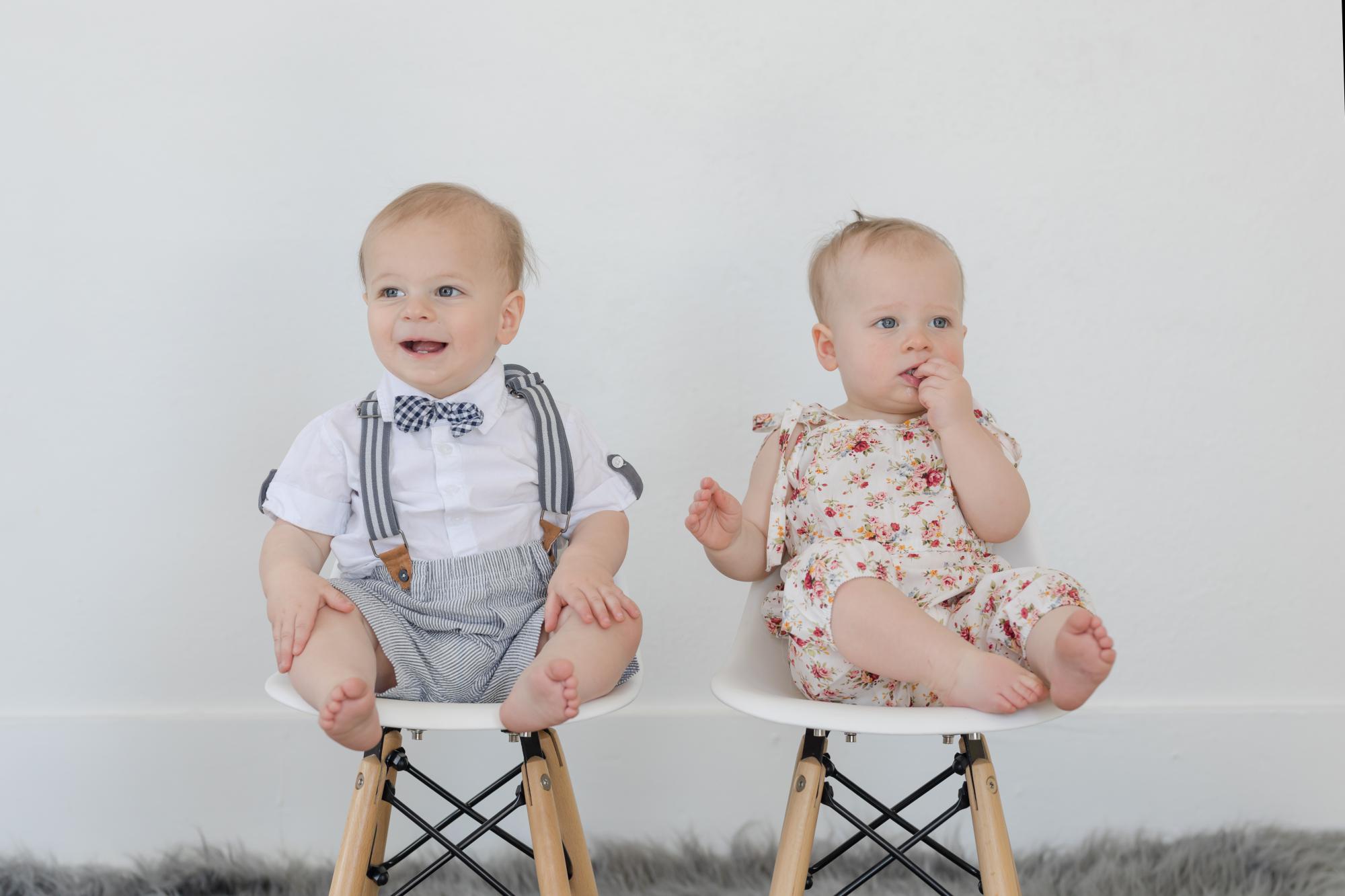 one year old twins in child photo studio