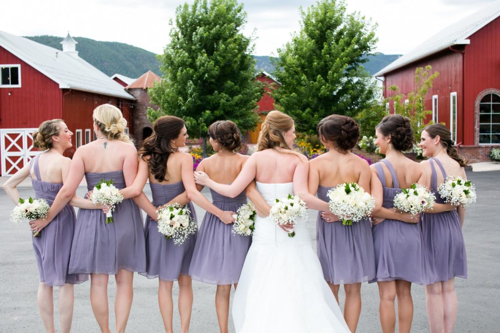 bridesmaids walking to crooked willow barn