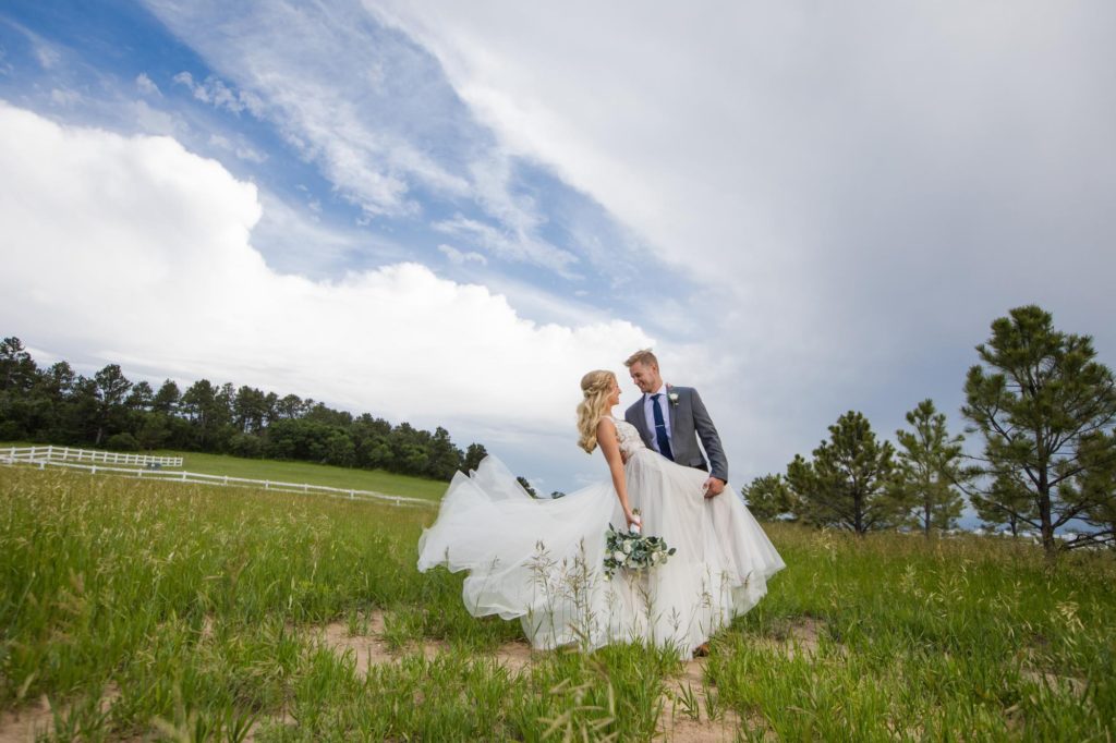 Colorado Springs couple at barn ranch wedding