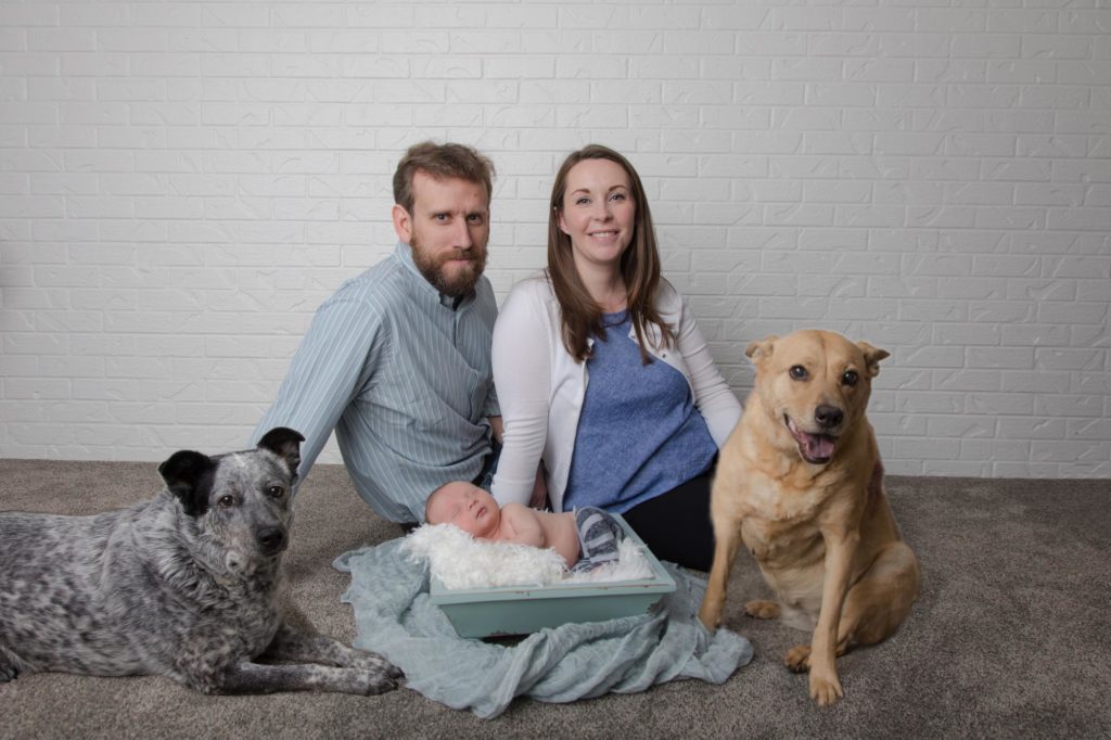 Family poses for Colorado Springs newborn photographer