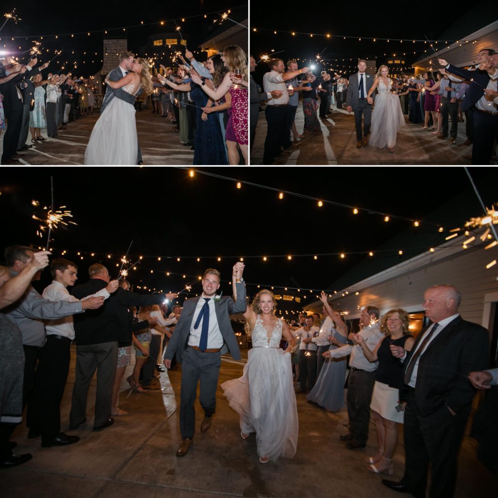 Bride and groom exit through a sparkler tunnel at their elegant Larkspur, Colorado wedding