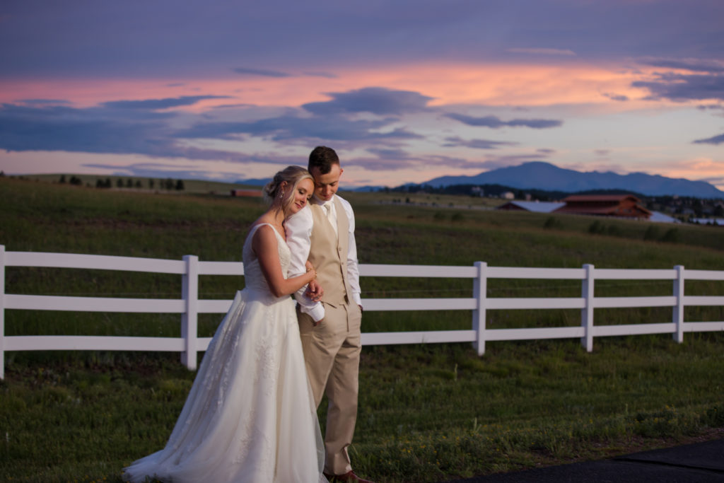 Denver couple embrace at sunset on their wedding day