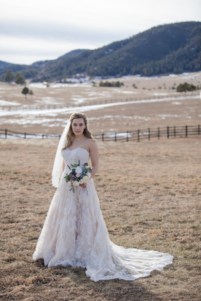 bride at winter mountain wedding