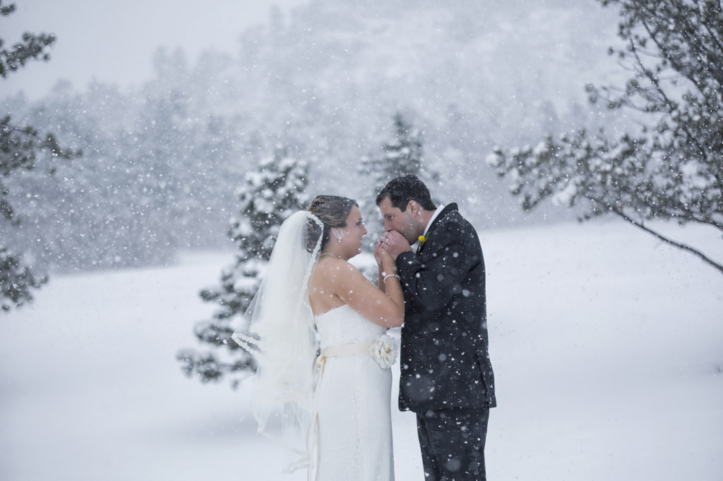 snowy newlywed photos at Spruce Mountain Ranch