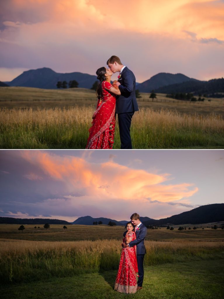 Multiracial wedding couple kiss in front of Rocky Mountains