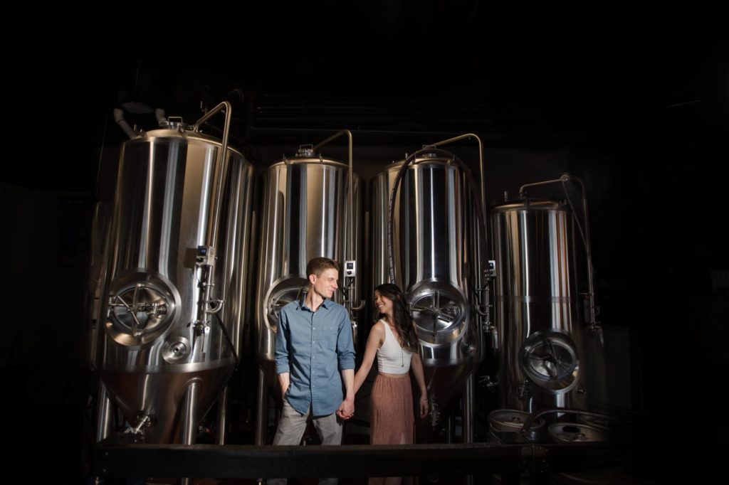 Denver couple in front of a brewery at rino engagement session