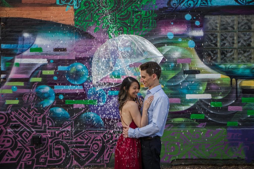 couple at denver engagement session get rained on