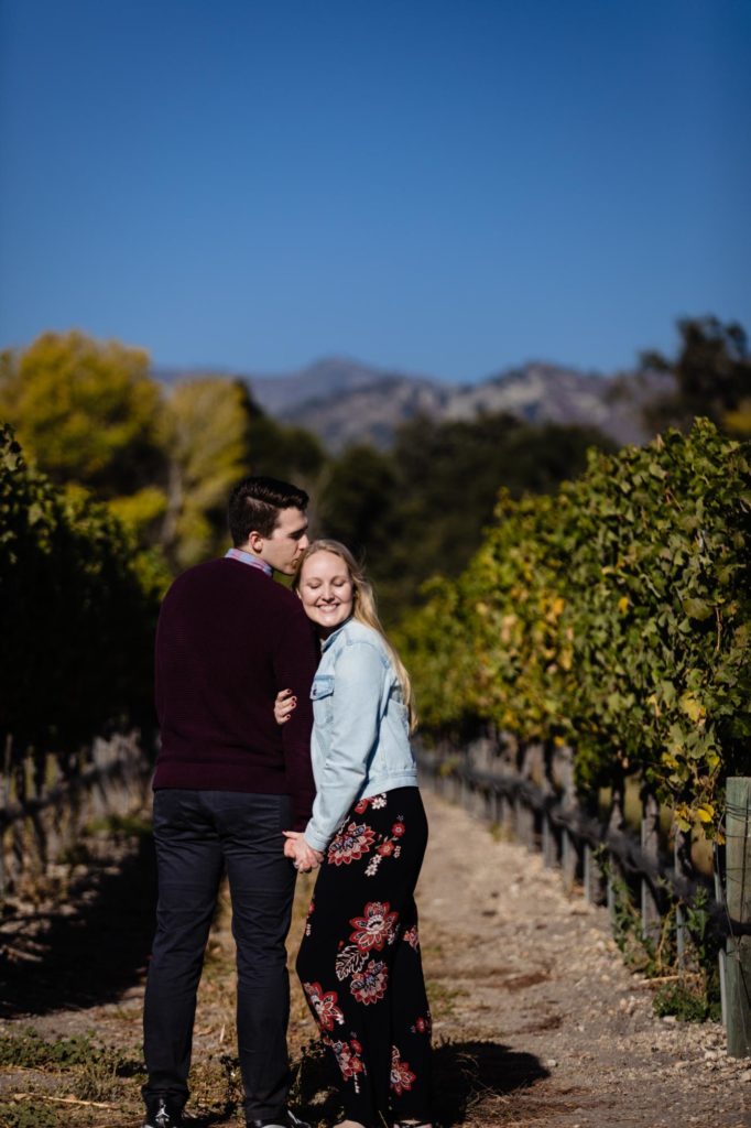 engaged couple in California vineyard