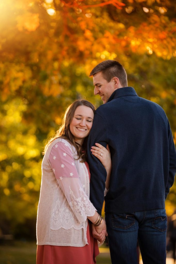 engaged couple at fall leaves session in Boulder