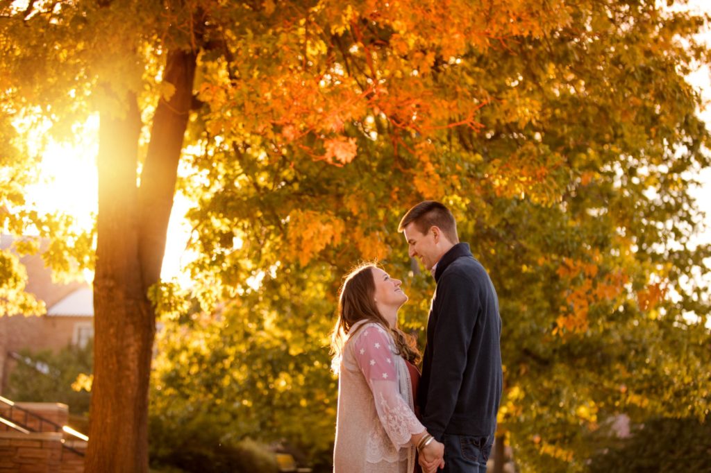 Couple under fall leaves