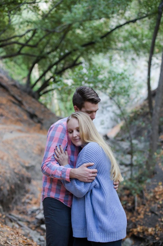 couple holds each other at California engagement session