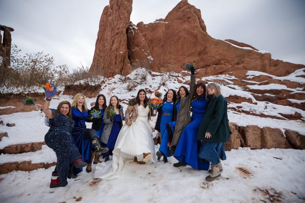 Couple eloping in Colorado poses with their family