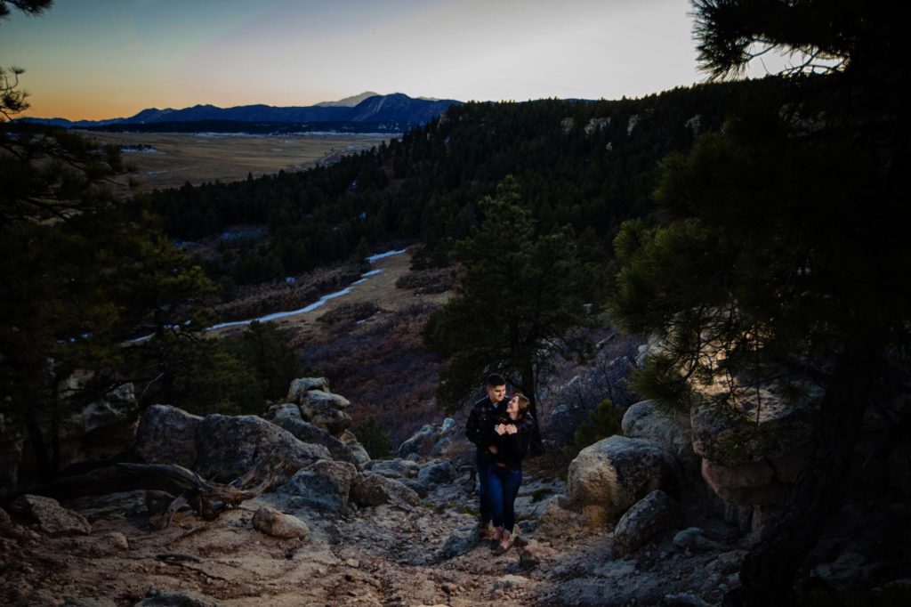 engaged couple pose for mountain engagement photos